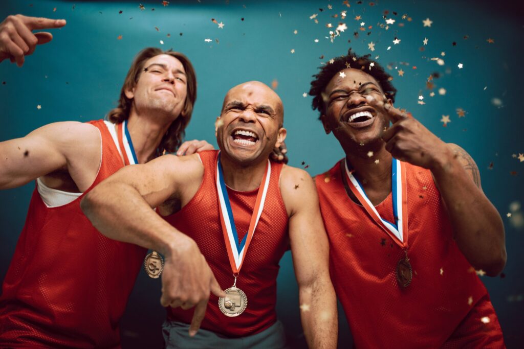 Photo by RDNE Stock project: https://www.pexels.com/photo/confetti-falling-on-proud-basketball-players-wearing-medals-7005759/